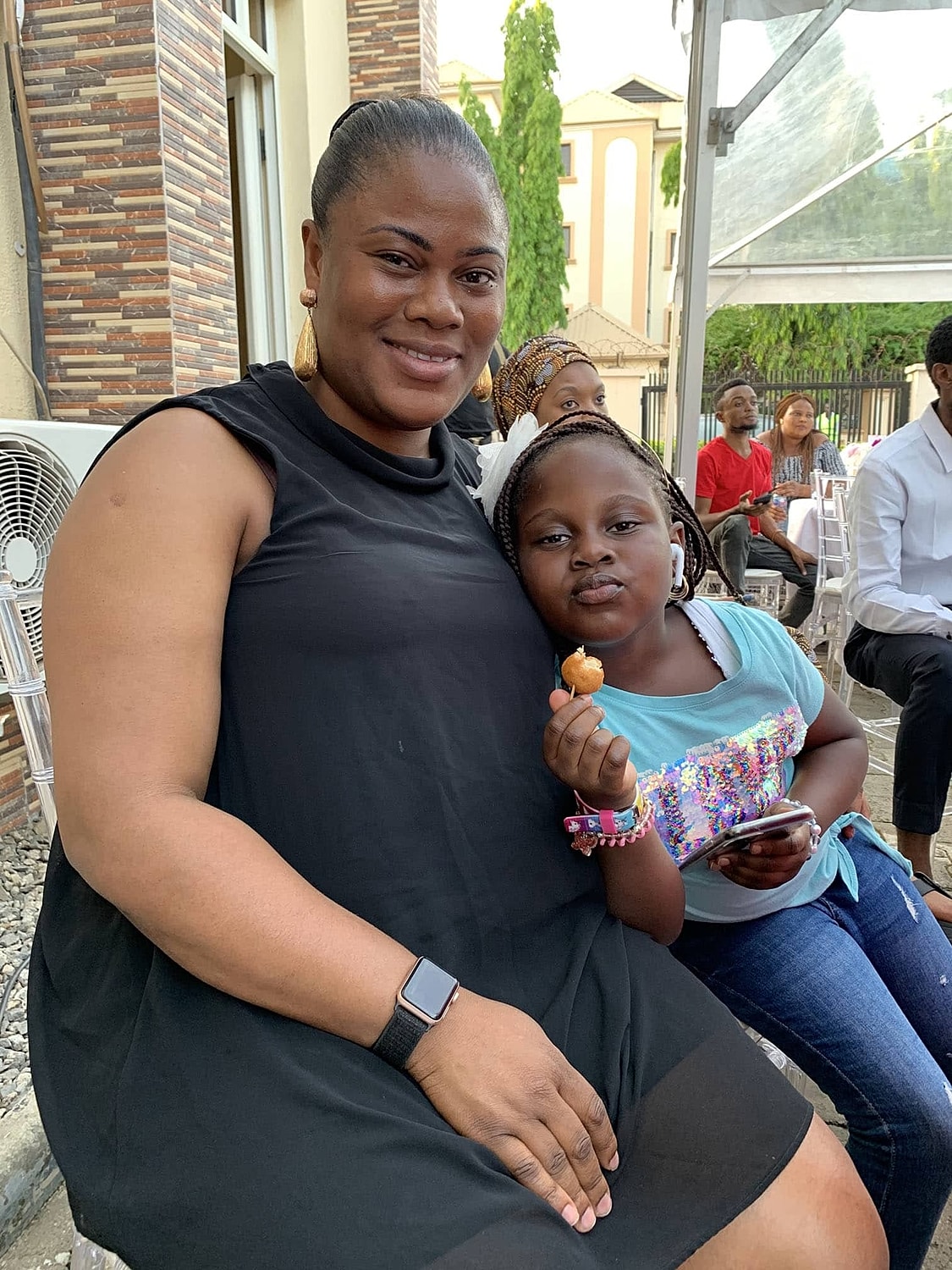 Mom and daughter enjoying a fun moment together.