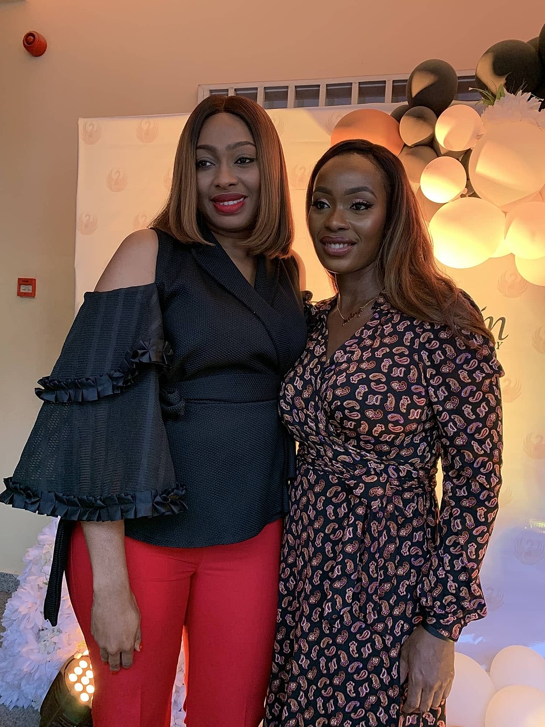 Two women posing at an event.