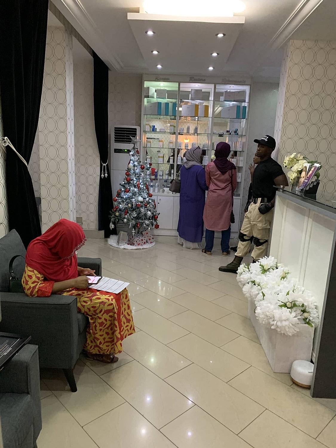 Beauty salon interior with customers and decor