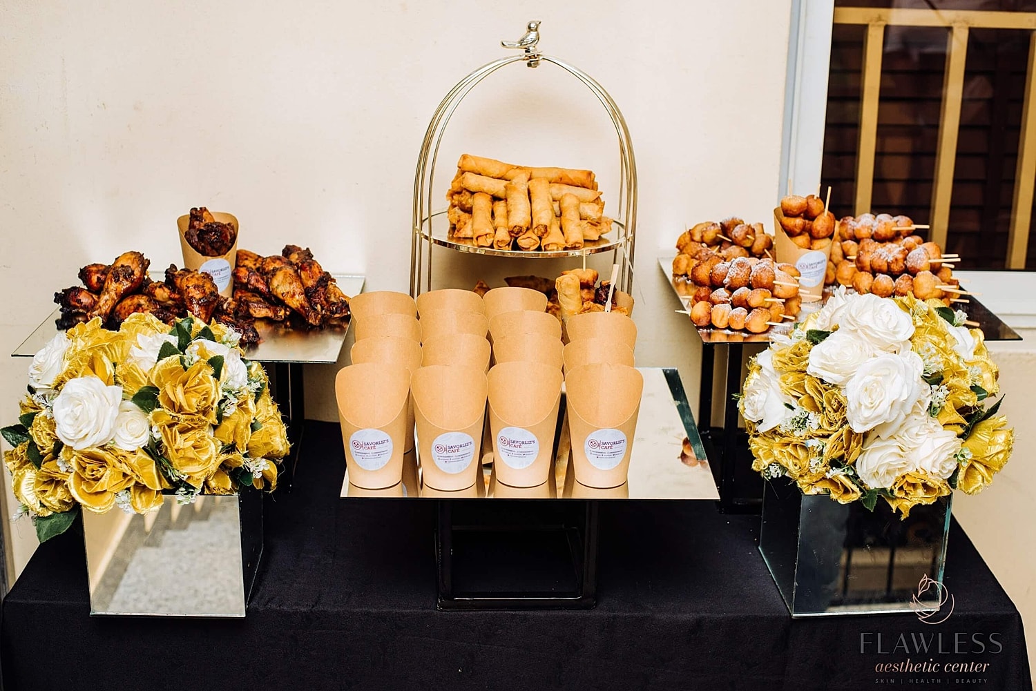 Assorted snacks and floral arrangements on display.