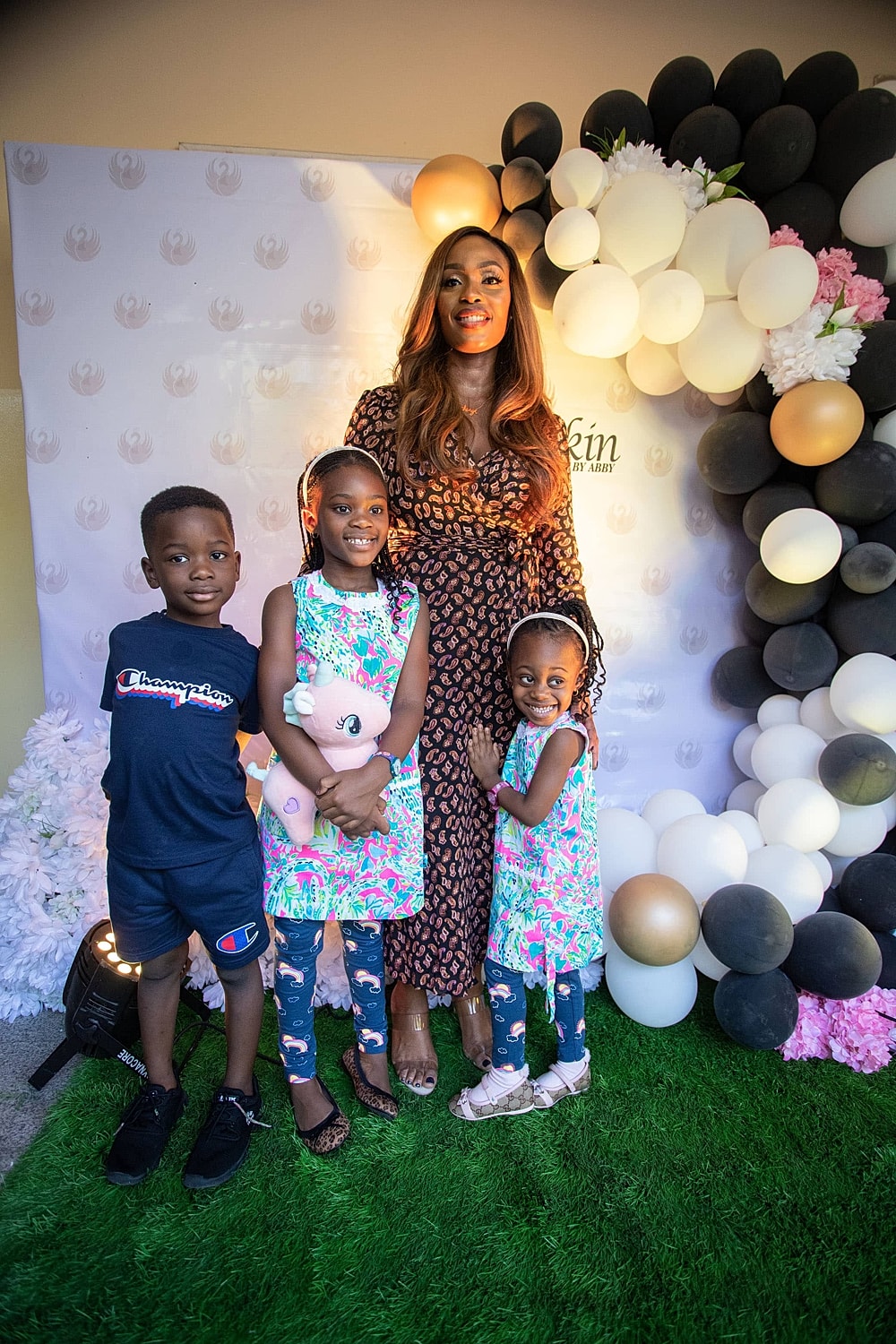 Family posing together at a celebration event.