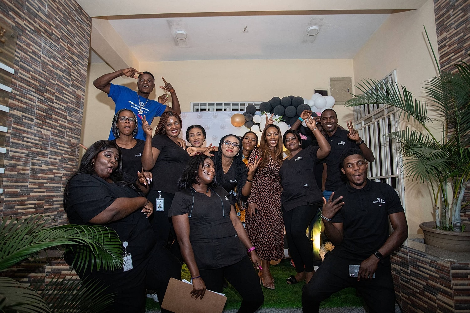 Team celebration with smiles and playful poses.