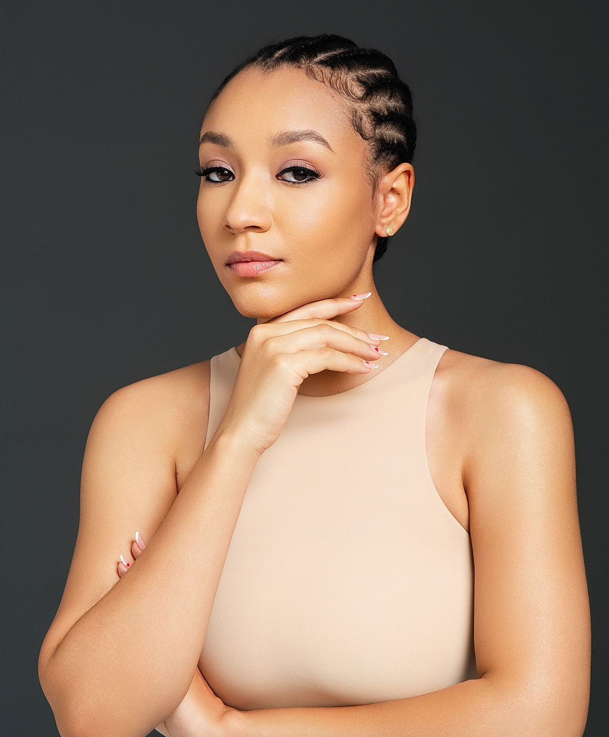 Abuja Chemical Peels model posing with hand on chin.