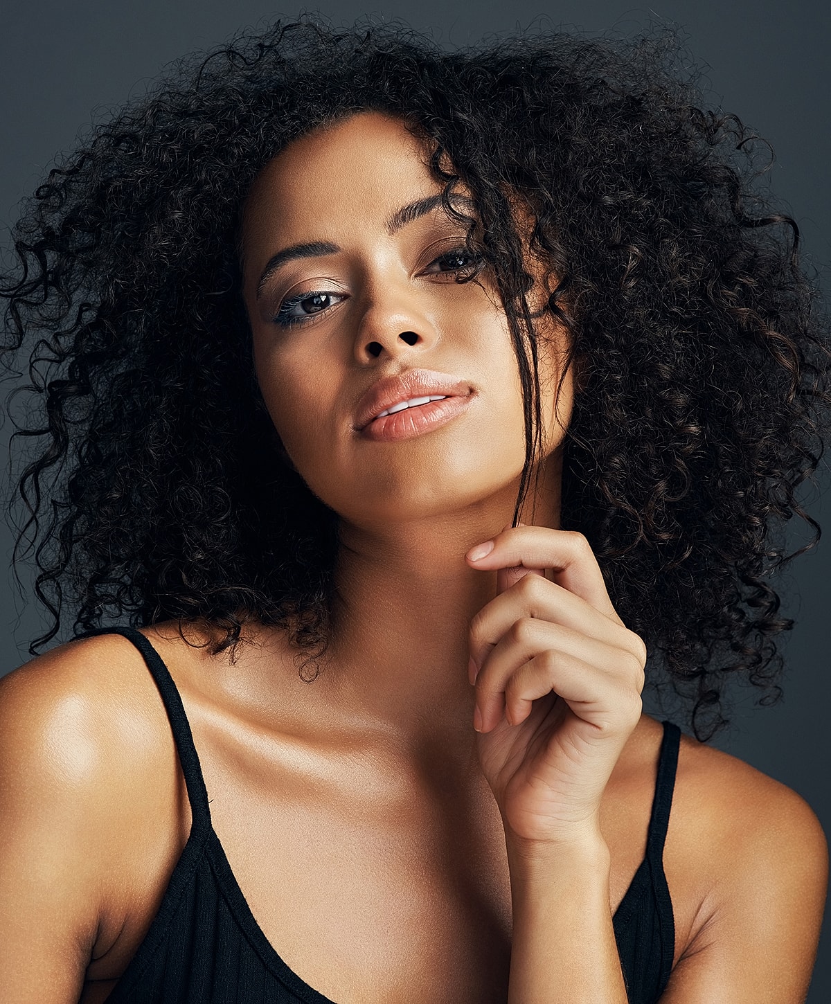 Portrait of a woman with curly hair.