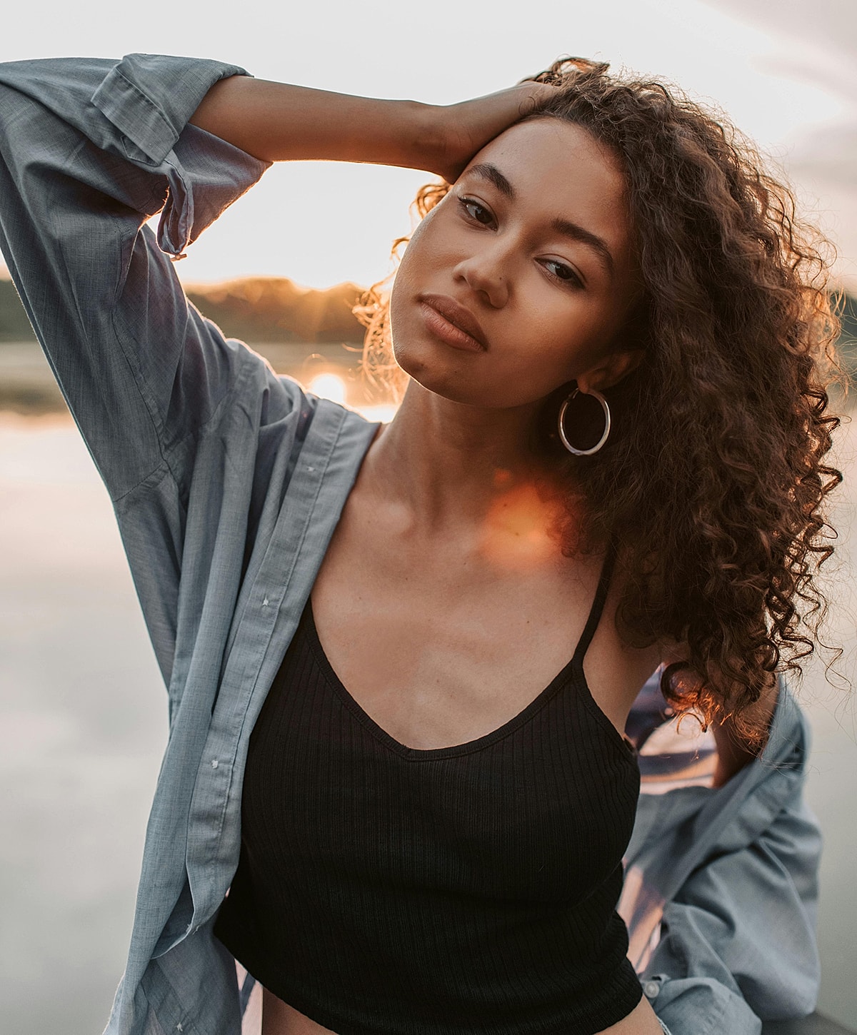Woman with beautiful skin and red nail polish.