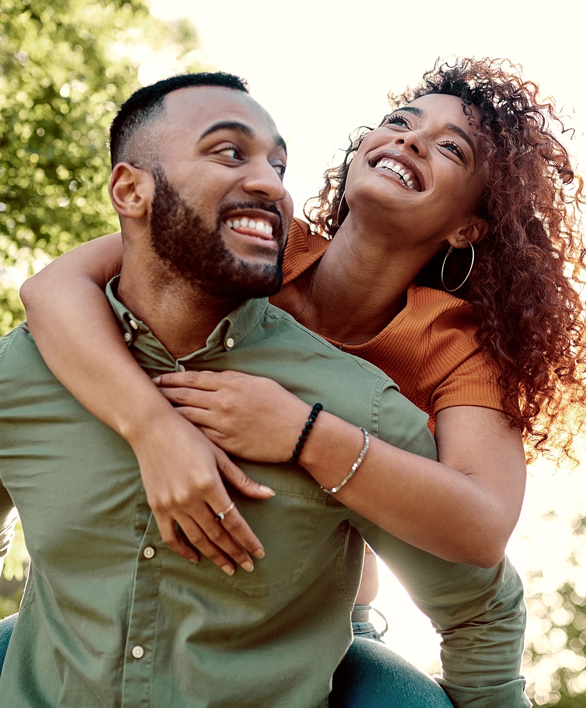 Couple enjoying a playful moment outdoors.