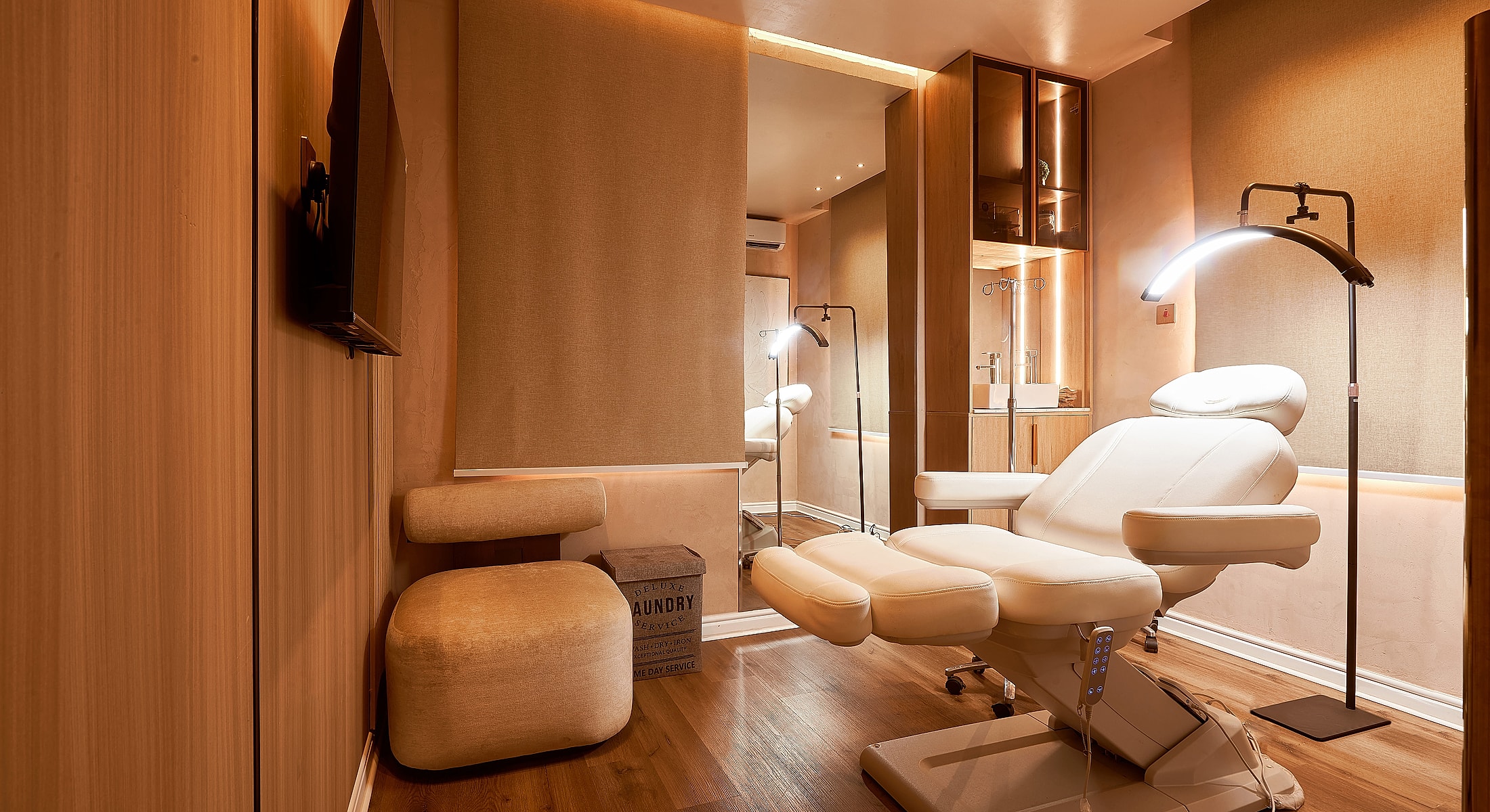 Modern aesthetic treatment room with lighting.