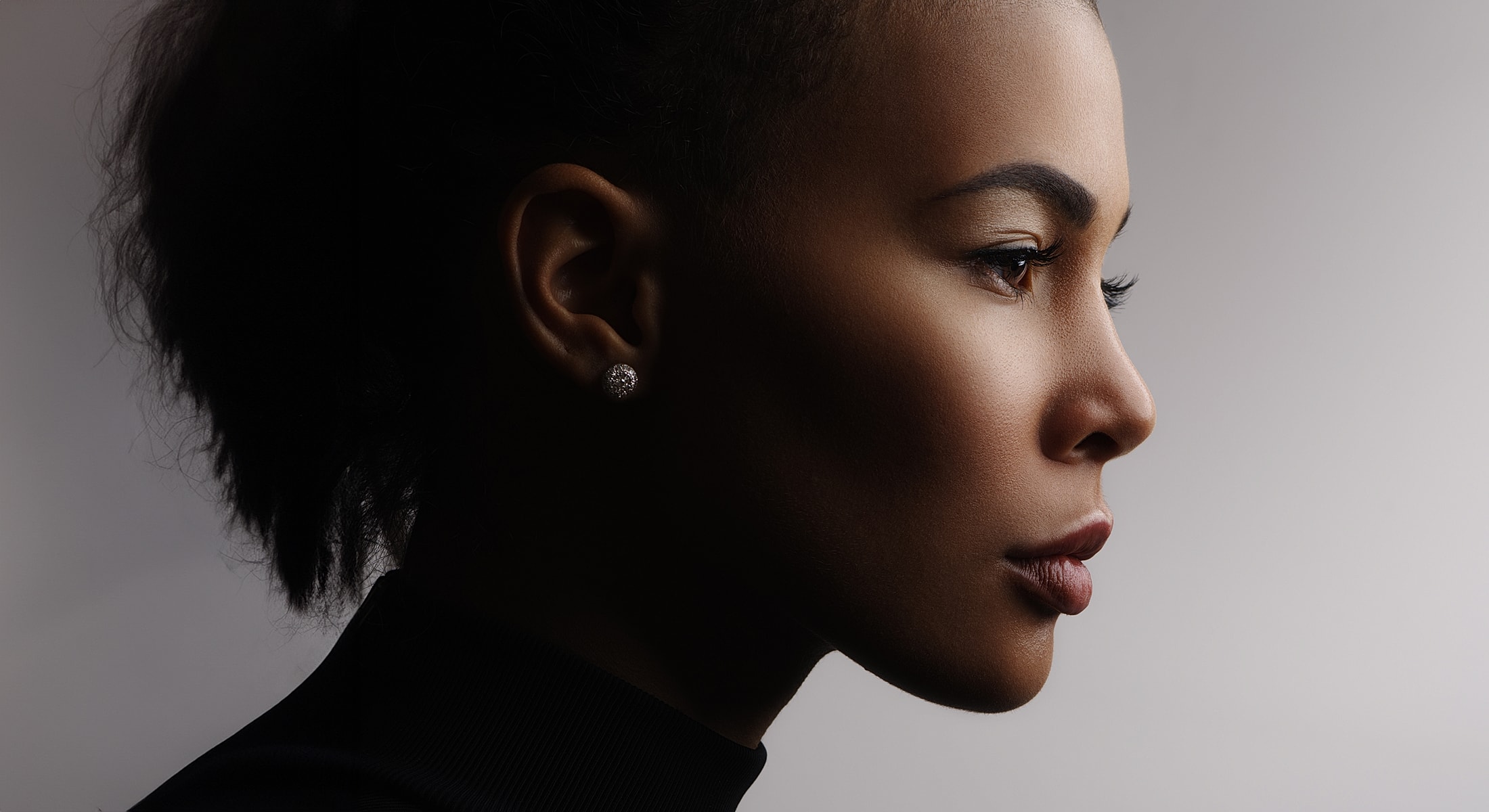 Profile portrait of a woman with elegant features.